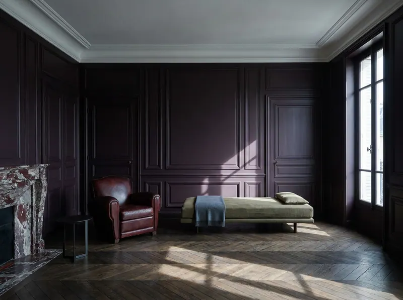 A private recovery salon designed for patients undergoing EBOO therapy and blood filtration — aubergine panelled walls, oxblood leather club chair and veined marble chimneypiece, specified by Beverly Hills Luxury Interiors