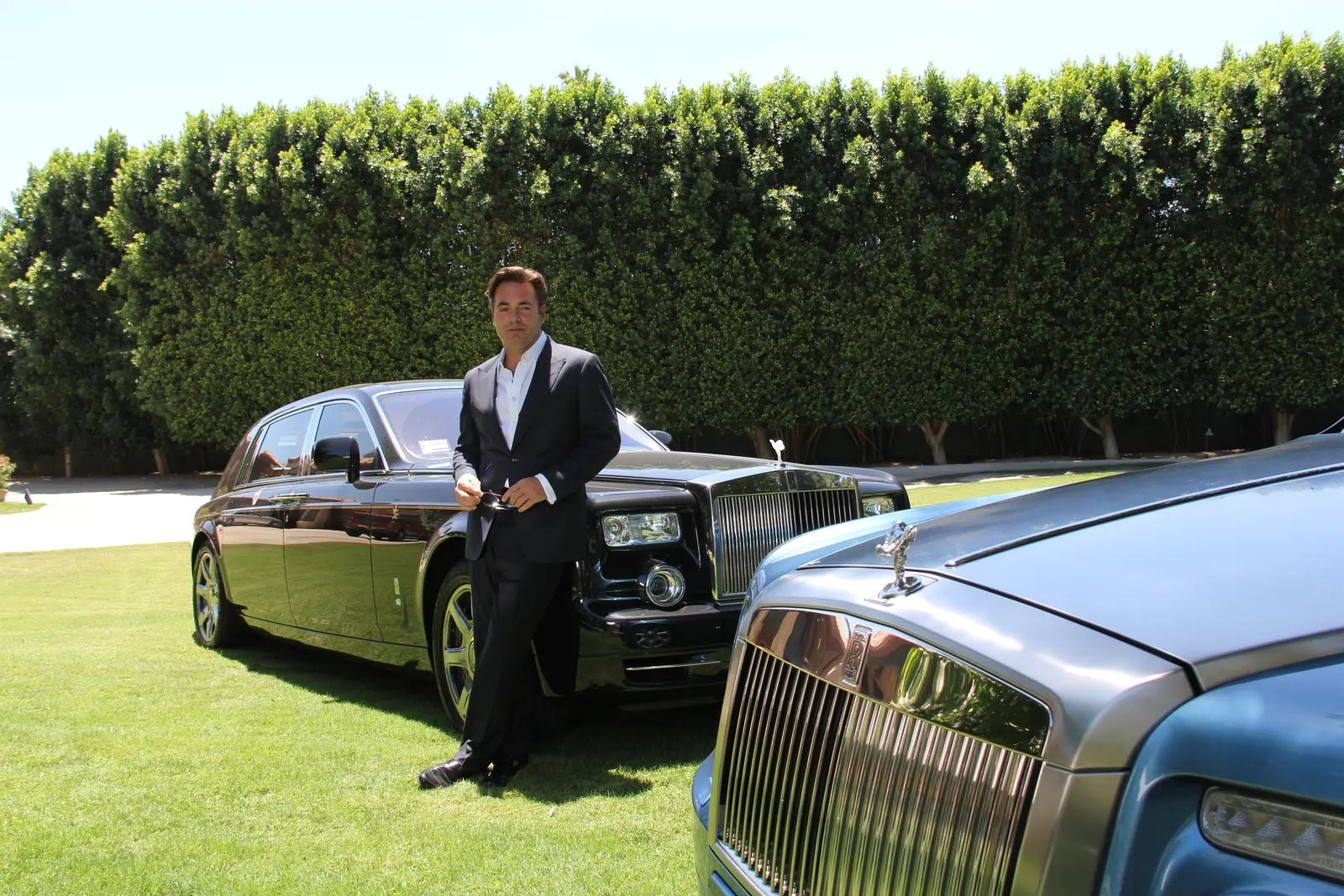 Kenneth Bordewick leaning on his custom Rolls Royce Phantom EWB