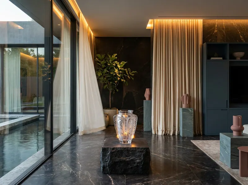 Ultra-luxury interior with prominent Lalique crystal vase embodying the four classical elements — Earth, Water, Fire, Air — by Beverly Hills Luxury Interiors